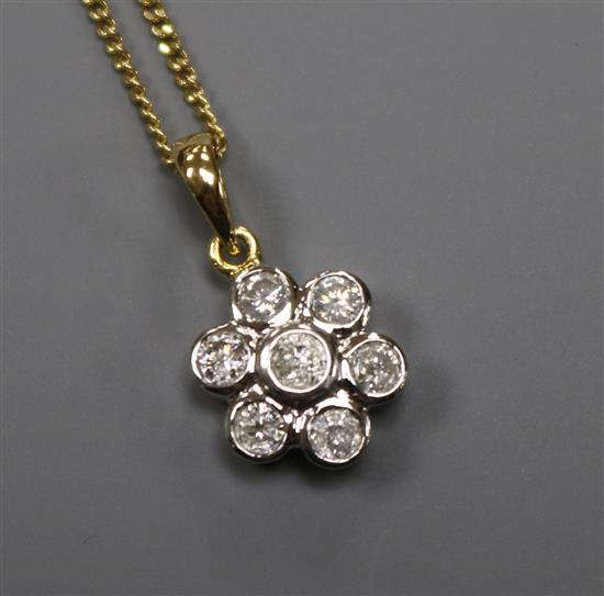 A modern 18ct gold and seven stone diamond cluster drop pendant, on an 18ct gold fine link chain, pendant 11mm.
